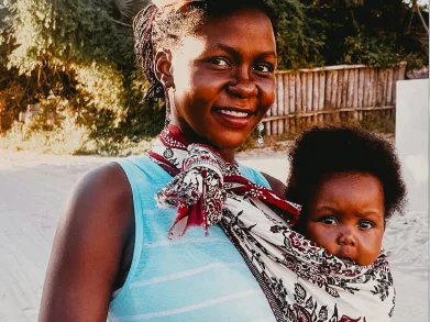 Mother holding a child for family support program